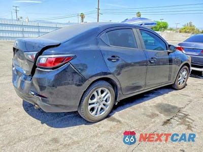 Trzecie zdjęcie samochodu z tyłu: 2017 TOYOTA YARIS IA BASE VIN:3MYDLBYV8HY192887 - miniatura