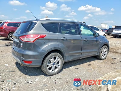 Trzecie zdjęcie samochodu z tyłu: 2016 FORD ESCAPE TITANIUM VIN:1FMCU9JX0GUA11256 - miniatura