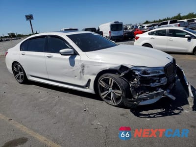 Czwarte zdjęcie samochodu z boku: 2018 BMW 750 I VIN:WBA7F0C50JGM23932 - miniatura