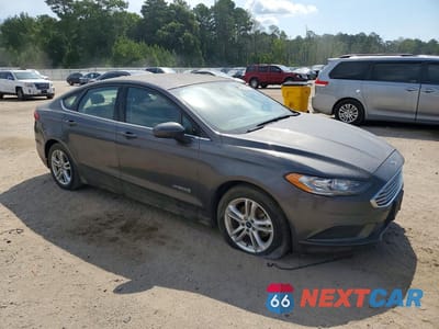 Czwarte zdjęcie samochodu z boku: 2018 FORD FUSION SE HYBRID VIN:3FA6P0LU7JR192805 - miniatura
