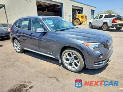 Czwarte zdjęcie samochodu z boku: 2014 BMW X1 XDRIVE28I VIN:WBAVL1C55EVY18180 - miniatura