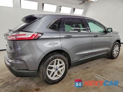 Trzecie zdjęcie samochodu z tyłu: 2022 FORD EDGE SEL VIN:2FMPK4J92NBA41020 - miniatura