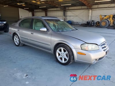 Czwarte zdjęcie samochodu z boku: 2002 NISSAN MAXIMA SE VIN:JN1DA31A42T001065 - miniatura