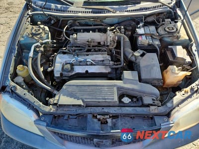 Zdjęcie 11 z 12 samochodu: 2001 MAZDA PROTEGE DX VIN:JM1BJ222010444965 - miniatura