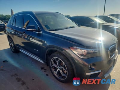 Czwarte zdjęcie samochodu z boku: 2017 BMW X1 SDRIVE28I VIN:WBXHU7C37H5H36864 - miniatura