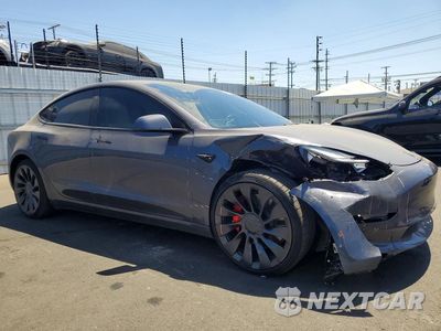Czwarte zdjęcie samochodu z boku: 2023 TESLA MODEL 3 VIN:5YJ3E1EC8PF509501 - miniatura