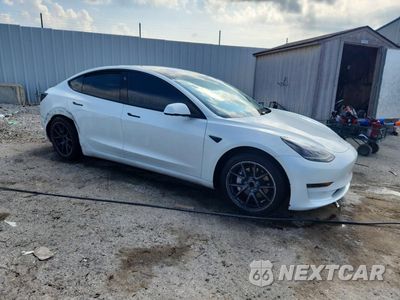 Czwarte zdjęcie samochodu z boku: 2023 TESLA MODEL 3 VIN:5YJ3E1EA7PF588058 - miniatura