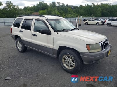 Czwarte zdjęcie samochodu z boku: 2003 JEEP GRAND CHEROKEE LAREDO VIN:1J4GW48SX3C605828 - miniatura