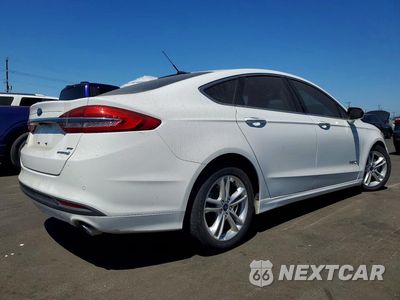Trzecie zdjęcie samochodu z tyłu: 2018 FORD FUSION SE HYBRID VIN:3FA6P0LU6JR171590 - miniatura