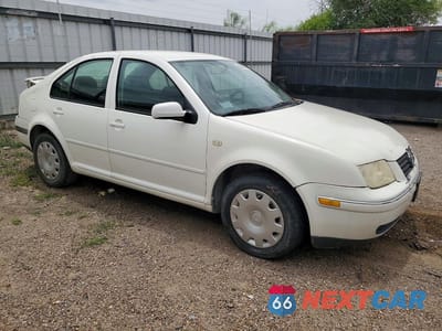 Czwarte zdjęcie samochodu z boku: 1999 VOLKSWAGEN JETTA GLS VIN:3VWSA29M5XM018828 - miniatura