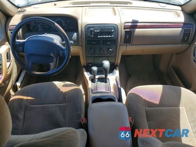 Zdjęcie 8 z 13 samochodu: 2000 JEEP GRAND CHEROKEE LAREDO VIN:1J4GW48S6YC114132 - miniatura