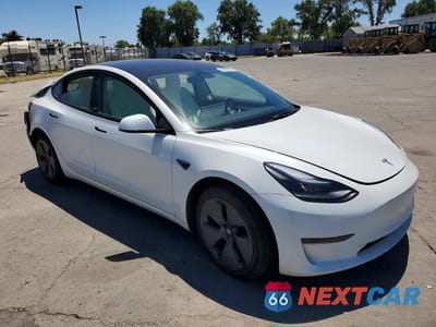 Czwarte zdjęcie samochodu z boku: 2023 TESLA MODEL 3 VIN:5YJ3E1EA3PF383417 - miniatura