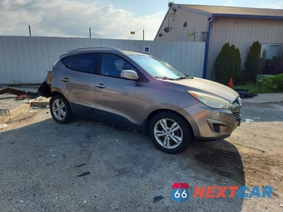 Czwarte zdjęcie samochodu z boku: 2011 HYUNDAI TUCSON GLS VIN:KM8JU3AC2BU171147 - miniatura