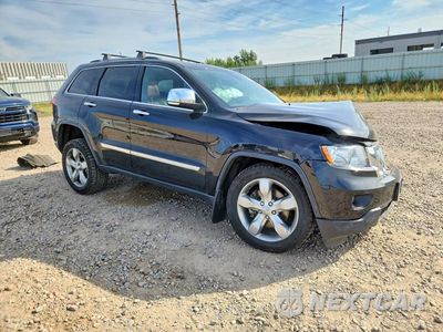 Czwarte zdjęcie samochodu z boku: 2013 JEEP GRAND CHEROKEE OVERLAND VIN:1C4RJFCT9DC577997 - miniatura