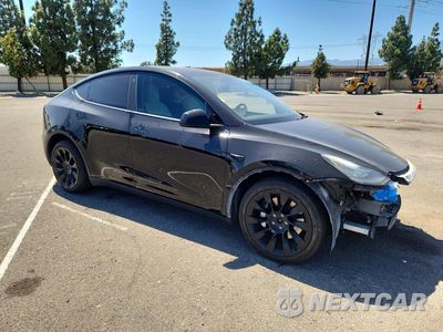 Czwarte zdjęcie samochodu z boku: 2021 TESLA MODEL Y VIN:5YJYGDEE0MF197933 - miniatura