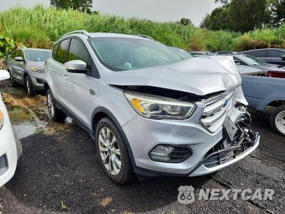 Czwarte zdjęcie samochodu z boku: 2018 FORD ESCAPE TITANIUM VIN:1FMCU0J92JUA42707 - miniatura