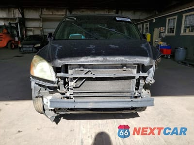 Piąte zdjęcie samochodu w środku: 2004 HONDA PILOT EXL VIN:5FNYF18524B006333 - miniatura