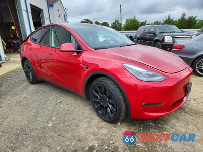 Czwarte zdjęcie samochodu z boku: 2023 TESLA MODEL Y VIN:7SAYGAEE0PF910609 - miniatura