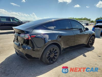 Trzecie zdjęcie samochodu z tyłu: 2023 TESLA MODEL Y VIN:7SAYGDEE7PA141797 - miniatura