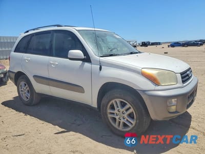 Czwarte zdjęcie samochodu z boku: 2001 TOYOTA RAV4 BASE VIN:JTEGH20V110020396 - miniatura