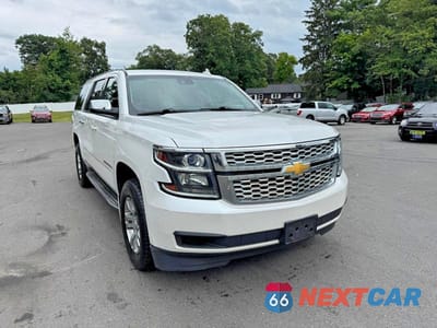Czwarte zdjęcie samochodu z boku: 2016 CHEVROLET SUBURBAN K1500 LT VIN:1GNSKHKC5GR239498 - miniatura