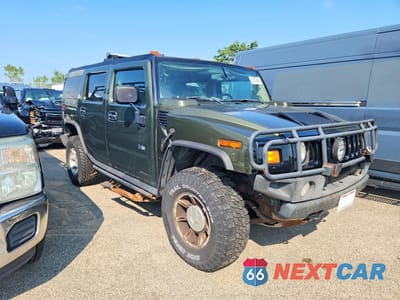 Czwarte zdjęcie samochodu z boku: 2003 HUMMER H2 VIN:5GRGN23U03H132240 - miniatura
