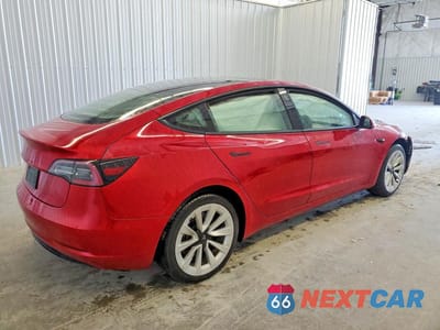 Trzecie zdjęcie samochodu z tyłu: 2023 TESLA MODEL 3 VIN:5YJ3E1EA5PF438837 - miniatura