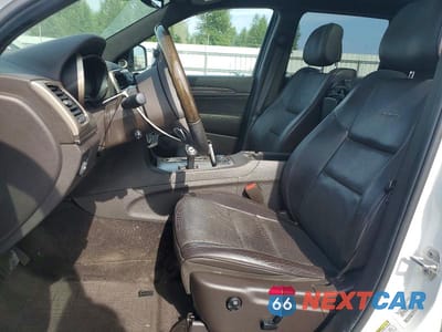 Zdjęcie 7 z 13 samochodu: 2014 JEEP GRAND CHEROKEE SUMMIT VIN:1C4RJFJM9EC300036 - miniatura