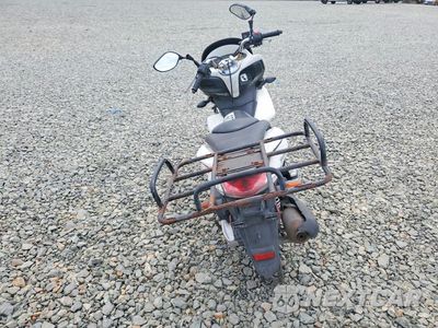 Czwarte zdjęcie samochodu z boku: 2011 HONDA PCX VIN:MLHJF2807B5001491 - miniatura
