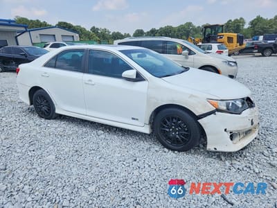 Czwarte zdjęcie samochodu z boku: 2014 TOYOTA CAMRY HYBRID SE VIN:4T1BD1FK9EU134500 - miniatura