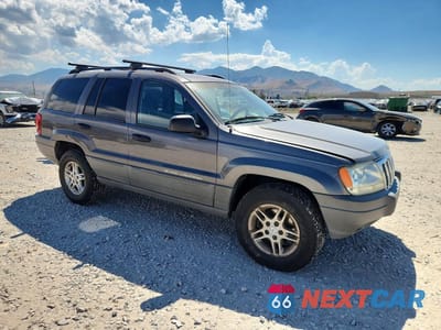 Czwarte zdjęcie samochodu z boku: 2002 JEEP GRAND CHEROKEE LAREDO VIN:1J4GW48S82C169852 - miniatura
