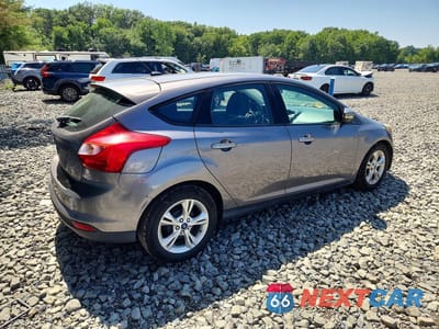 Trzecie zdjęcie samochodu z tyłu: 2013 FORD FOCUS SE VIN:1FADP3K28DL305043 - miniatura