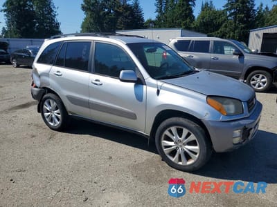 Czwarte zdjęcie samochodu z boku: 2001 TOYOTA RAV4 BASE VIN:JTEGH20V610020748 - miniatura