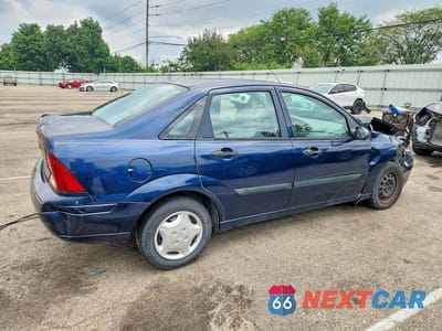 Trzecie zdjęcie samochodu z tyłu: 2003 FORD FOCUS LX VIN:1FAFP33PX3W267816 - miniatura