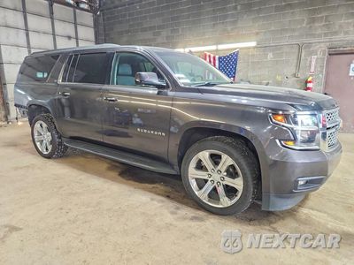 Czwarte zdjęcie samochodu z boku: 2017 CHEVROLET SUBURBAN K1500 LT VIN:1GNSKHKCXHR375997 - miniatura