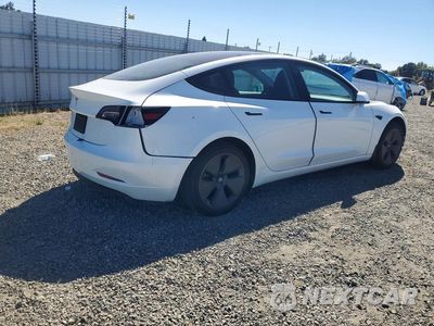 Trzecie zdjęcie samochodu z tyłu: 2023 TESLA MODEL 3 VIN:5YJ3E1EA1PF573670 - miniatura