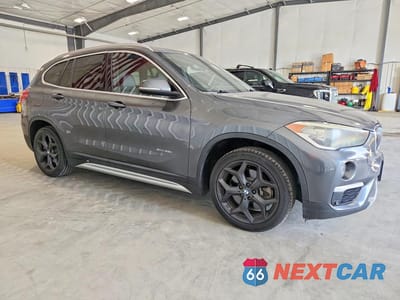 Czwarte zdjęcie samochodu z boku: 2016 BMW X1 XDRIVE28I VIN:WBXHT3C38GP887076 - miniatura