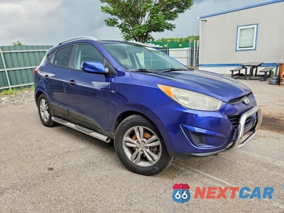Czwarte zdjęcie samochodu z boku: 2011 HYUNDAI TUCSON GLS VIN:KM8JUCAC4BU200843 - miniatura