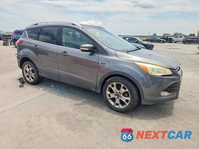 Czwarte zdjęcie samochodu z boku: 2014 FORD ESCAPE TITANIUM VIN:1FMCU9J99EUE52589 - miniatura