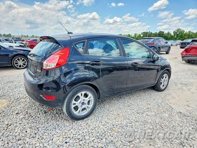 Trzecie zdjęcie samochodu z tyłu: 2014 FORD FIESTA SE VIN:3FADP4EJ9EM196570 - miniatura