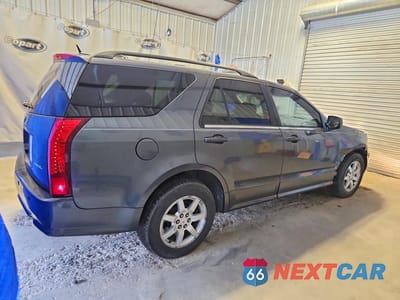 Trzecie zdjęcie samochodu z tyłu: 2009 CADILLAC SRX VIN:1GYEE637990111480 - miniatura
