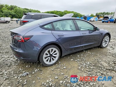 Trzecie zdjęcie samochodu z tyłu: 2023 TESLA MODEL 3 VIN:5YJ3E1EB3PF663900 - miniatura