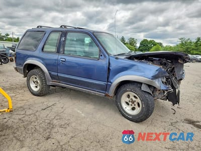 Czwarte zdjęcie samochodu z boku: 1999 FORD EXPLORER XLT VIN:1FMZU24E6XUC82169 - miniatura