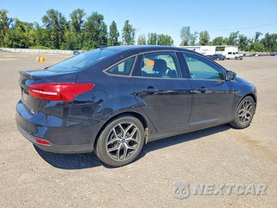 Trzecie zdjęcie samochodu z tyłu: 2018 FORD FOCUS SE VIN:1FADP3FE6JL313805 - miniatura