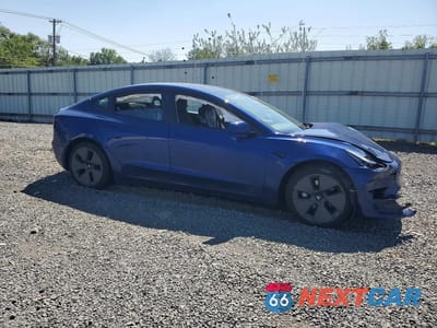 Czwarte zdjęcie samochodu z boku: 2023 TESLA MODEL 3 VIN:5YJ3E1EA9PF609606 - miniatura