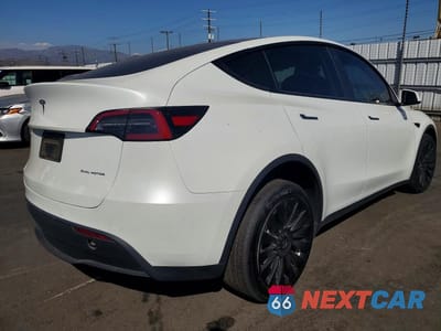 Trzecie zdjęcie samochodu z tyłu: 2022 TESLA MODEL Y VIN:7SAYGDEE9NF557902 - miniatura