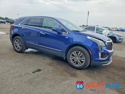 Czwarte zdjęcie samochodu z boku: 2023 CADILLAC XT5 PREMIUM LUXURY VIN:1GYKNCR48PZ138130 - miniatura