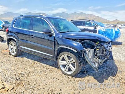 Czwarte zdjęcie samochodu z boku: 2014 VOLKSWAGEN TIGUAN S VIN:WVGBV3AX2EW084670 - miniatura