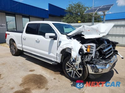 Czwarte zdjęcie samochodu z boku: 2022 FORD F150 SUPERCREW VIN:1FTFW1E87NFB57476 - miniatura