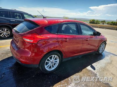 Trzecie zdjęcie samochodu z tyłu: 2017 FORD FOCUS SE VIN:1FADP3K29HL337442 - miniatura